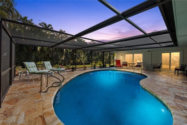 6012 Perthshire Ln, Fort Myers, FL 33908 - pool at dusk featuring an outdoor pool, a patio, a lanai, and ceiling fan
