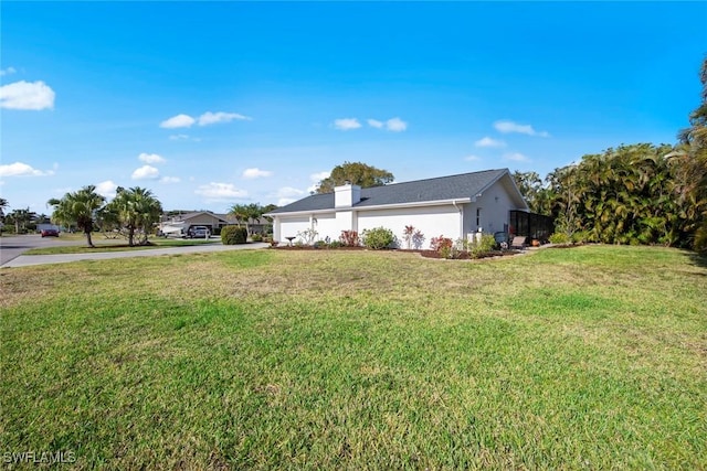 6012 Perthshire Ln, Fort Myers, FL 33908 - view of side of property featuring concrete driveway, a lawn, an attached garage, and stucco siding