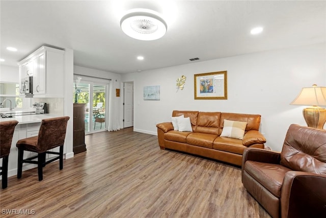 6012 Perthshire Ln, Fort Myers, FL 33908 - living area featuring light wood-style flooring, recessed lighting, and baseboards