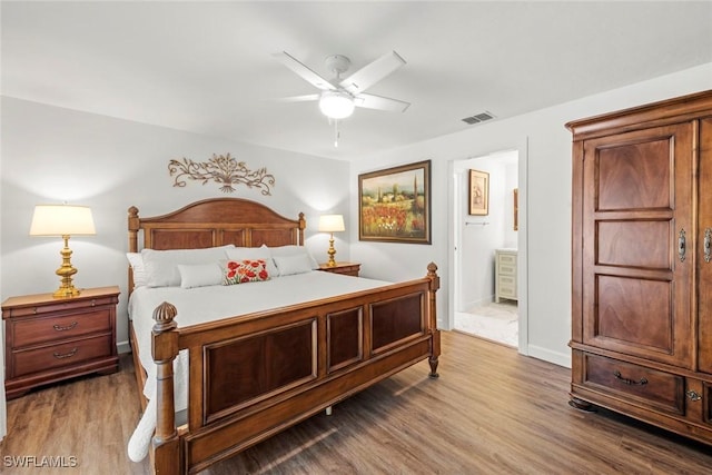 6012 Perthshire Ln, Fort Myers, FL 33908 - bedroom featuring wood finished floors, ensuite bathroom, a ceiling fan, and baseboards