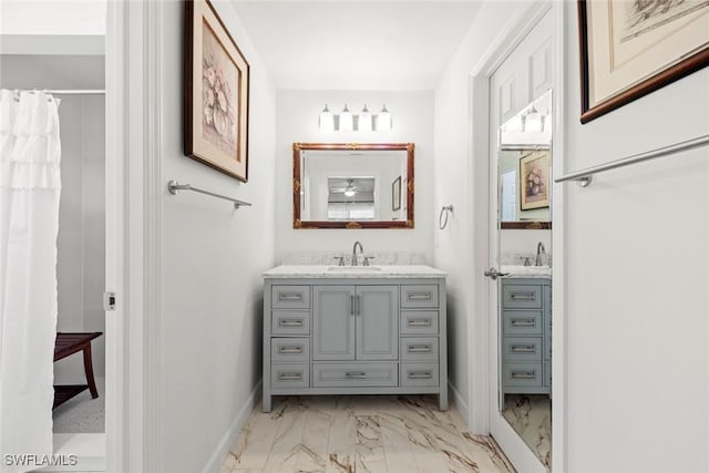 6012 Perthshire Ln, Fort Myers, FL 33908 - bathroom with marble finish flooring, baseboards, vanity, and curtained shower