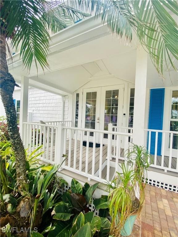 8315 Main St, Bokeelia, FL 33922 - entrance to property featuring french doors and a porch