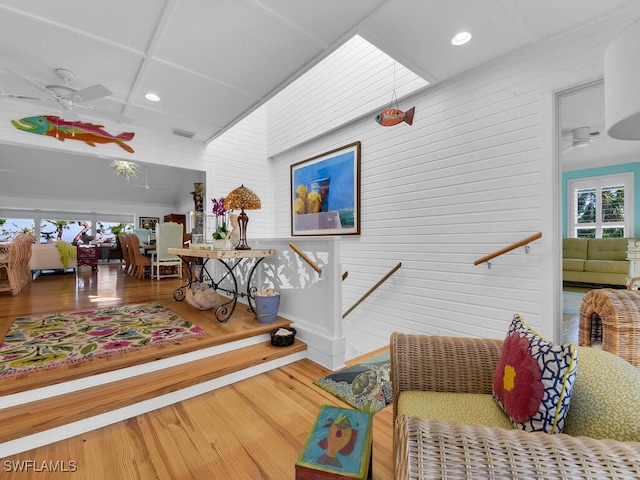 8315 Main St, Bokeelia, FL 33922 - interior space with ceiling fan, wood walls, recessed lighting, wood finished floors, and coffered ceiling