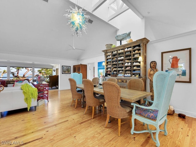 8315 Main St, Bokeelia, FL 33922 - dining room featuring wood finished floors and high vaulted ceiling