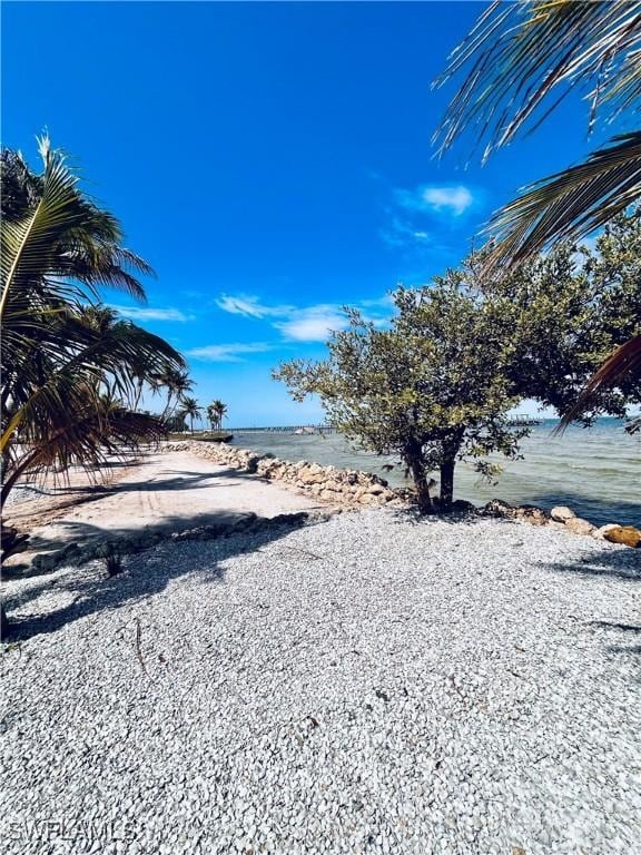 8315 Main St, Bokeelia, FL 33922 - view of yard featuring a beach view and a water view