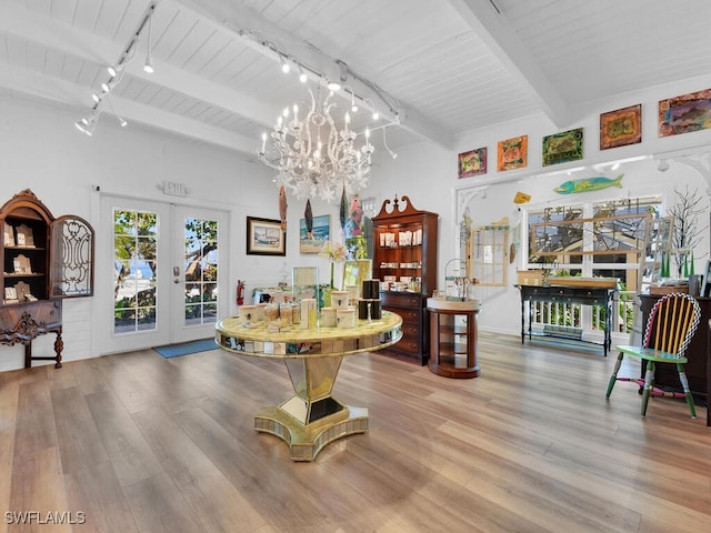 8315 Main St, Bokeelia, FL 33922 - interior space with french doors, rail lighting, and beam ceiling