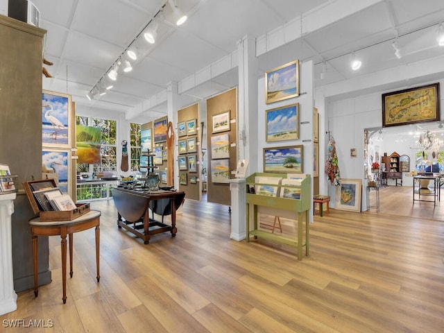 8315 Main St, Bokeelia, FL 33922 - interior space with track lighting and wood finished floors