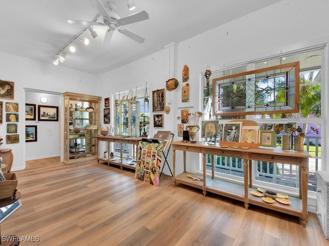 8315 Main St, Bokeelia, FL 33922 - misc room with ceiling fan, rail lighting, and wood finished floors