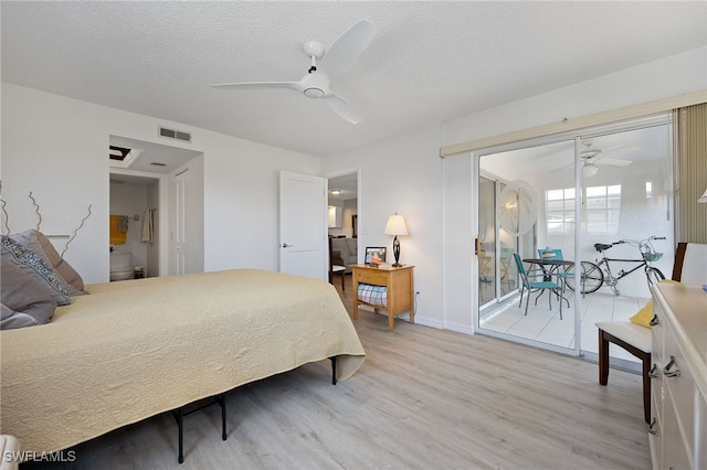 15400 River Vista Dr Unit 304, North Fort Myers, FL 33917 - bedroom with visible vents, light wood-style floors, baseboards, ceiling fan, and a textured ceiling