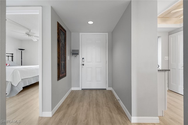 15400 River Vista Dr Unit 304, North Fort Myers, FL 33917 - hallway with light wood-style floors, baseboards, and recessed lighting