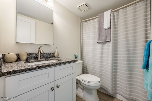 15400 River Vista Dr Unit 304, North Fort Myers, FL 33917 - full bath with vanity, a shower with curtain, toilet, and visible vents