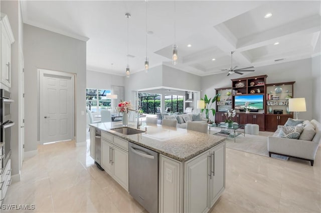 9052 Graphite Cir, Naples, FL 34120 - kitchen featuring stainless steel appliances, a sink, a ceiling fan, open floor plan, and coffered ceiling