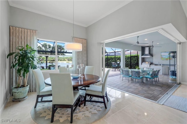 9052 Graphite Cir, Naples, FL 34120 - dining area with a towering ceiling, ceiling fan, ornamental molding, and baseboards