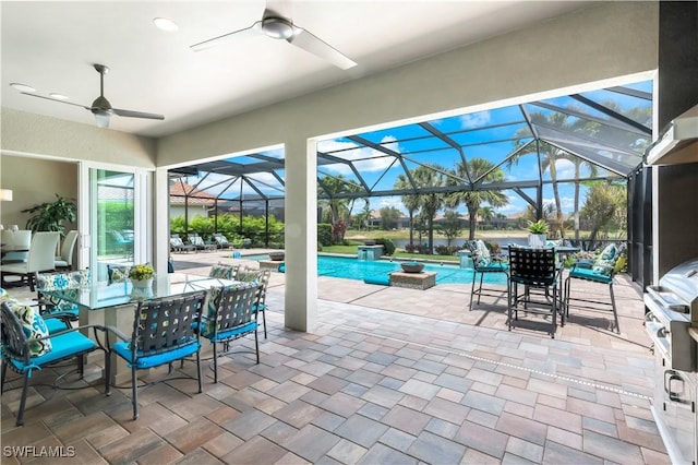 9052 Graphite Cir, Naples, FL 34120 - view of patio / terrace featuring outdoor dining area, ceiling fan, an outdoor pool, glass enclosure, and a grill