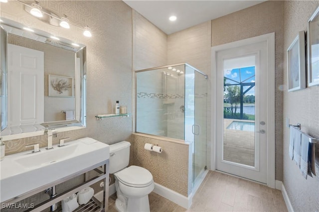 9052 Graphite Cir, Naples, FL 34120 - full bathroom with toilet, a stall shower, vanity, and baseboards