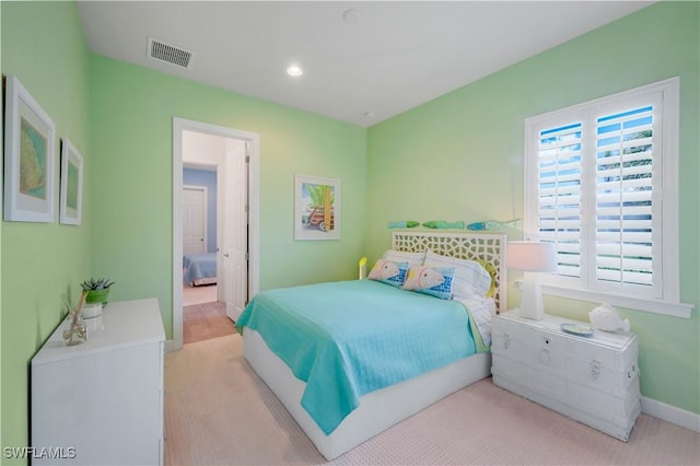 9052 Graphite Cir, Naples, FL 34120 - carpeted bedroom with recessed lighting, baseboards, and ensuite bathroom