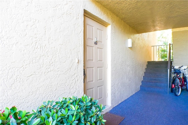 7116 Lakeridge Ct Unit 103, Fort Myers, FL 33907 - view of exterior entry with stucco siding