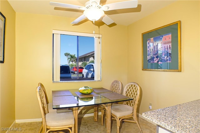 7116 Lakeridge Ct Unit 103, Fort Myers, FL 33907 - tiled dining room featuring baseboards and ceiling fan