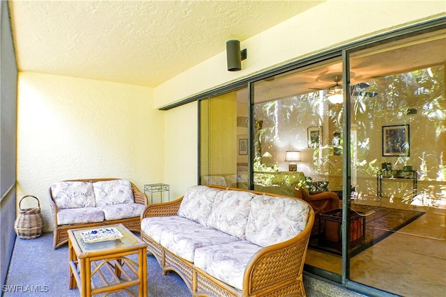 7116 Lakeridge Ct Unit 103, Fort Myers, FL 33907 - carpeted living room featuring a textured ceiling and a textured wall