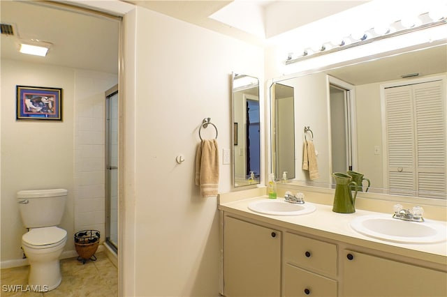 7116 Lakeridge Ct Unit 103, Fort Myers, FL 33907 - full bathroom with a shower stall, a closet, double vanity, toilet, and a sink
