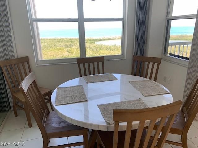 dining space featuring light tile patterned floors
