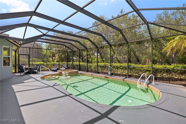 9890 Rookery Cir, Estero, FL 33928 - view of pool featuring a patio, a pool with connected hot tub, and glass enclosure
