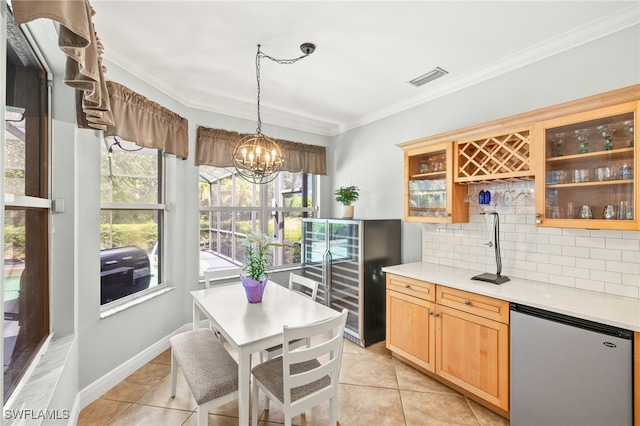 9890 Rookery Cir, Estero, FL 33928 - kitchen featuring light countertops, light tile patterned floors, backsplash, refrigerator, and visible vents
