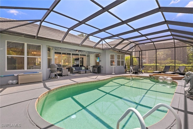 9890 Rookery Cir, Estero, FL 33928 - view of pool featuring a lanai, a ceiling fan, an outdoor hangout area, and a patio area