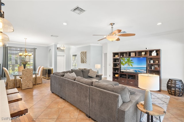 9890 Rookery Cir, Estero, FL 33928 - living room with visible vents, ornamental molding, recessed lighting, ceiling fan with notable chandelier, and light tile patterned floors