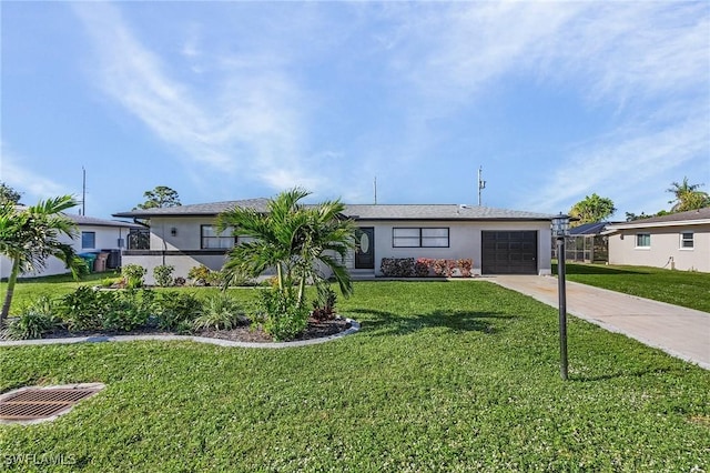ranch-style house featuring a front yard, stucco siding, driveway, and an attached garage