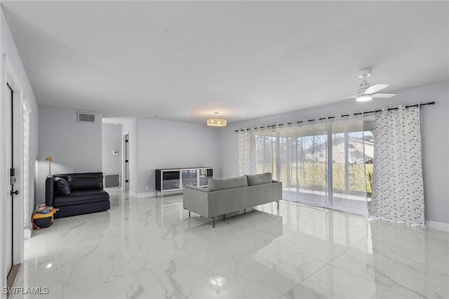 living room with baseboards, visible vents, a ceiling fan, and marble finish floor