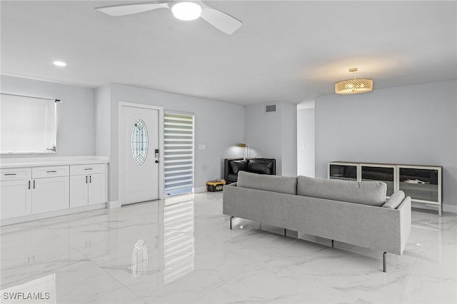 living area with recessed lighting, marble finish floor, ceiling fan, baseboards, and visible vents