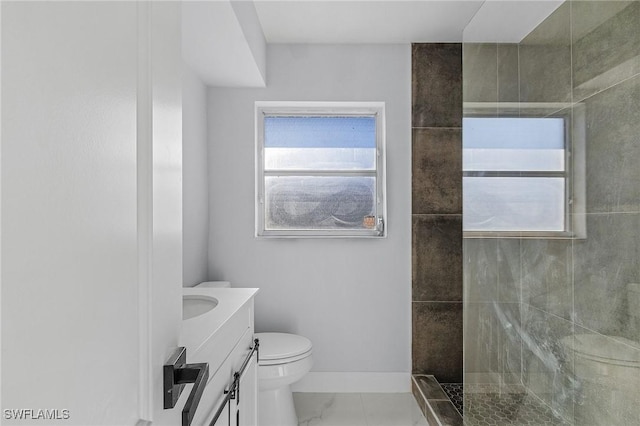 full bathroom with baseboards, toilet, a walk in shower, vanity, and marble finish floor