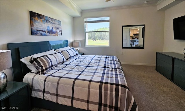 carpeted bedroom featuring baseboards and crown molding