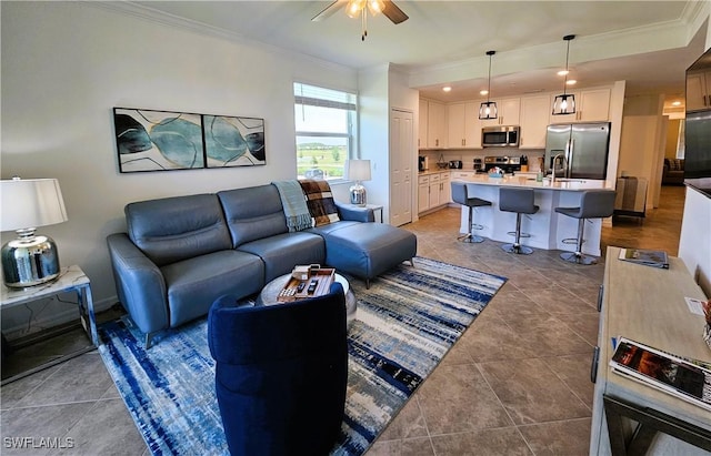 tiled living room with recessed lighting, ornamental molding, and ceiling fan
