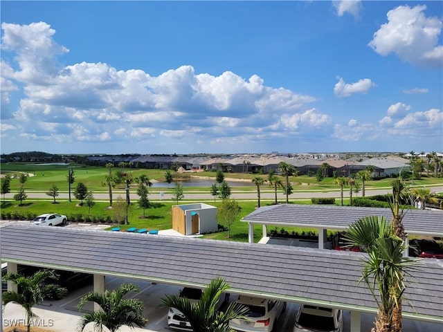 drone / aerial view featuring golf course view and a residential view