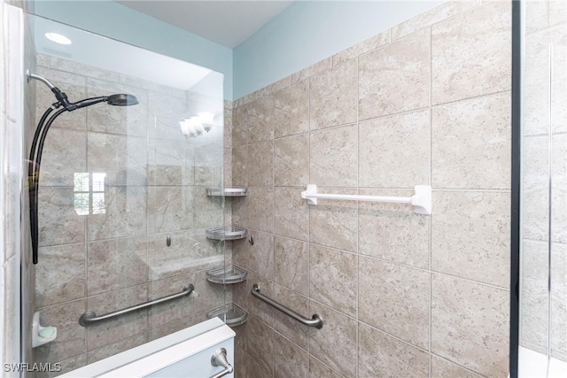 bathroom with a tile shower