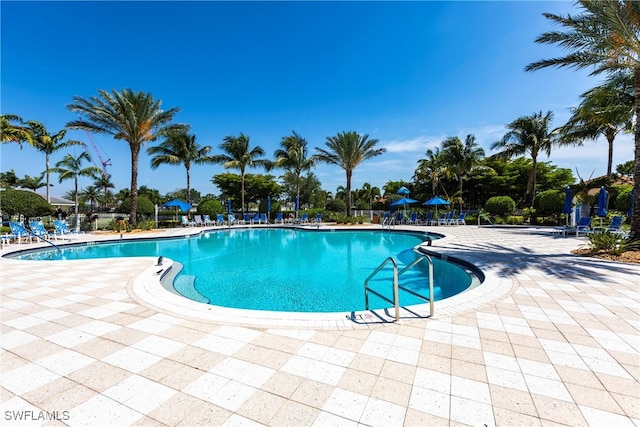 community pool featuring a patio area