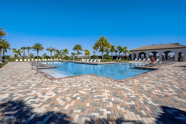 community pool with a patio area
