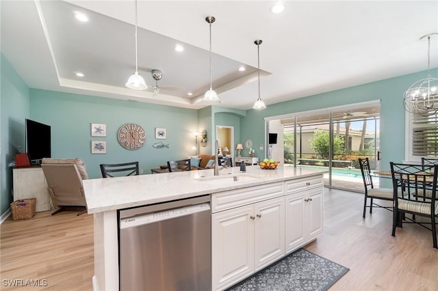 kitchen with stainless steel dishwasher, white cabinetry, recessed lighting, and light wood-style floors