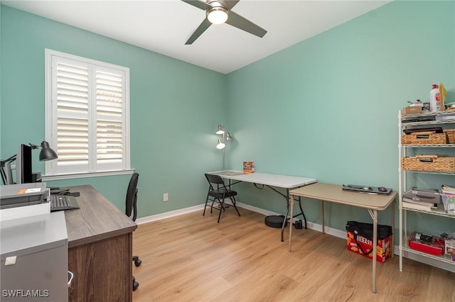 home office with baseboards, a ceiling fan, and wood finished floors