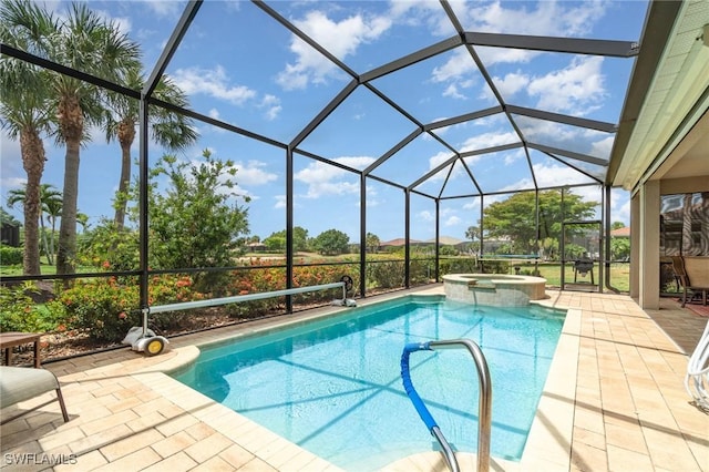 view of pool with glass enclosure, a patio, and a pool with connected hot tub