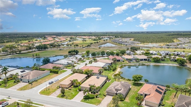 bird's eye view with a water view and a residential view