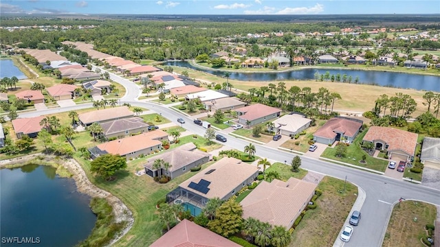 bird's eye view with a water view and a residential view