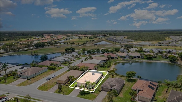 bird's eye view with a water view and a residential view
