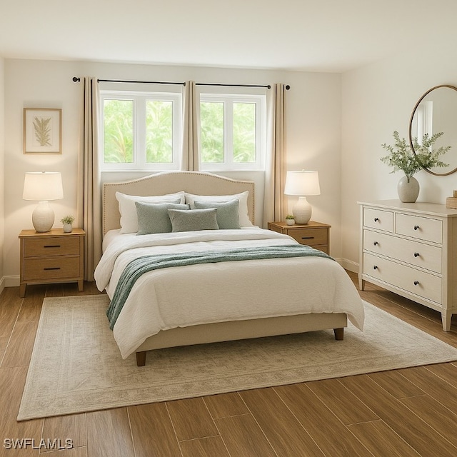 428 Meadowlark Ln Unit A, Naples, FL 34105 - bedroom featuring baseboards and wood finished floors