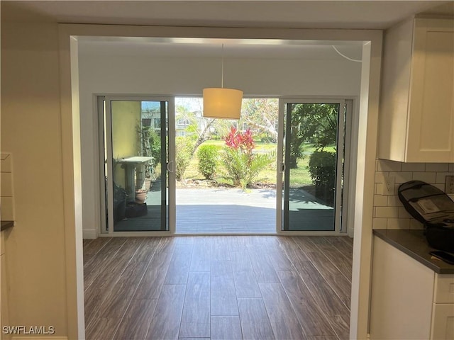 428 Meadowlark Ln Unit A, Naples, FL 34105 - doorway to outside featuring wood finished floors