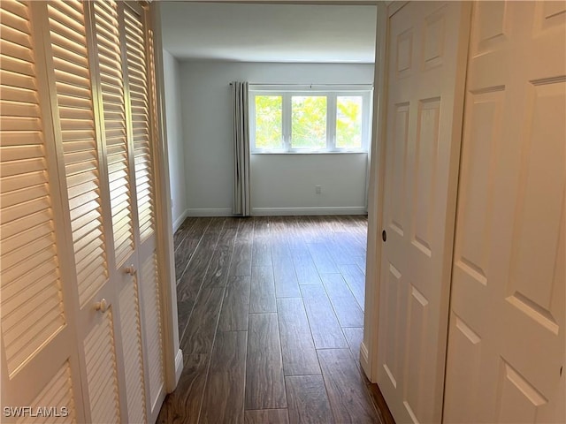 428 Meadowlark Ln Unit A, Naples, FL 34105 - unfurnished bedroom with dark wood-type flooring and baseboards