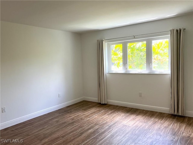 428 Meadowlark Ln Unit A, Naples, FL 34105 - unfurnished room featuring baseboards and wood finished floors