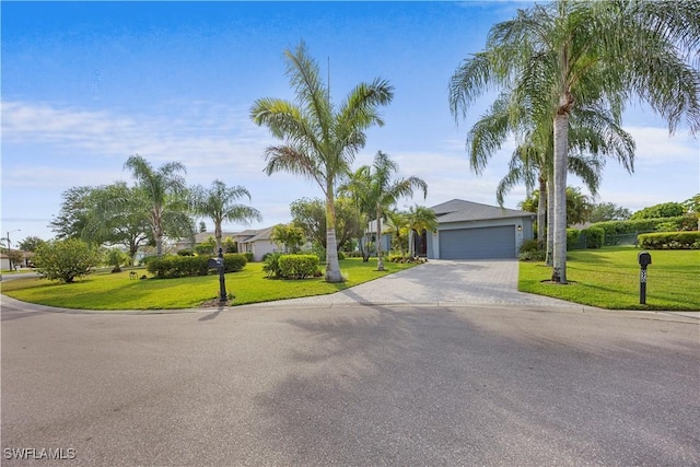 view of front of home featuring driveway and a front yard